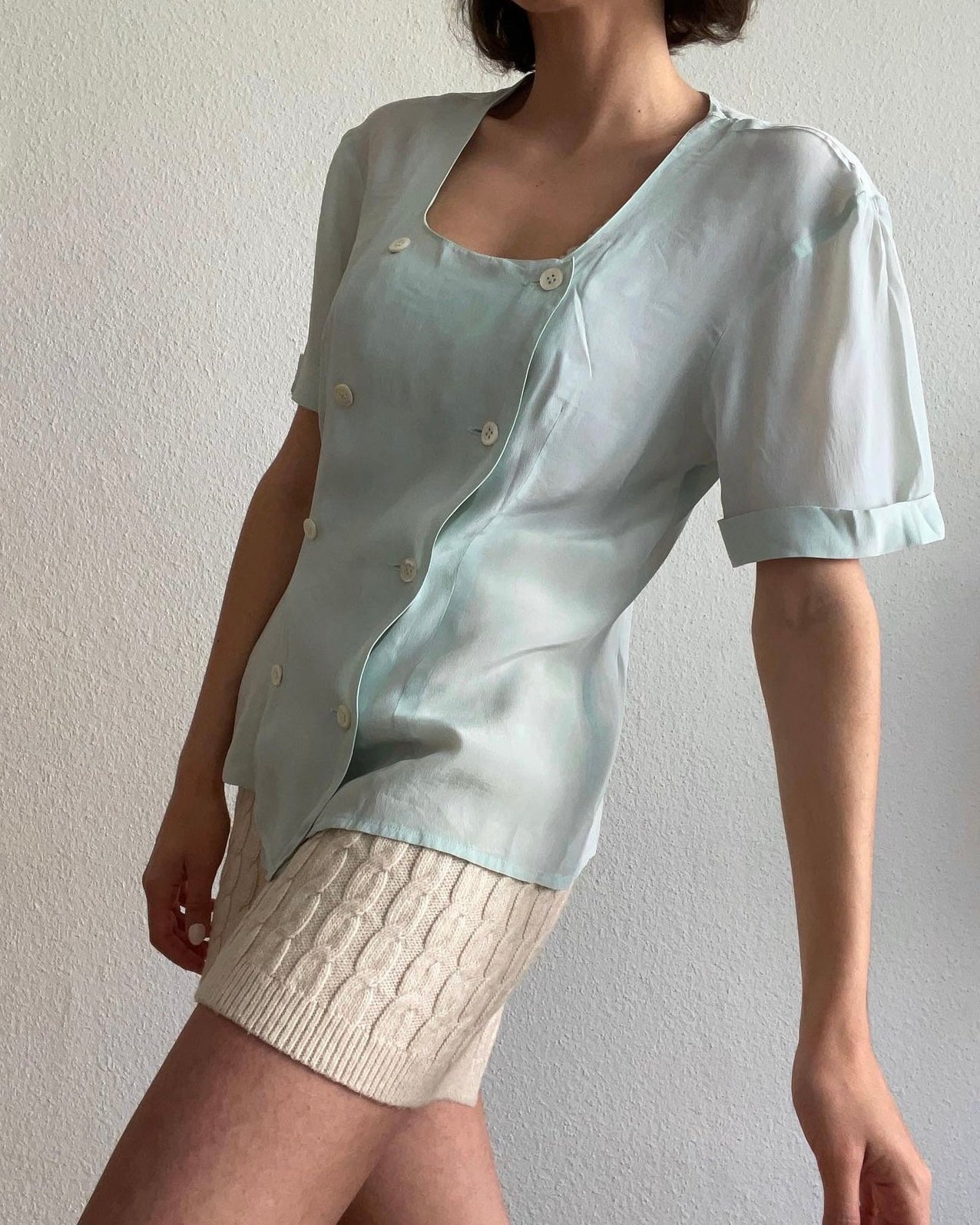 Light blue blouse with double buttonholes, very fine fabric