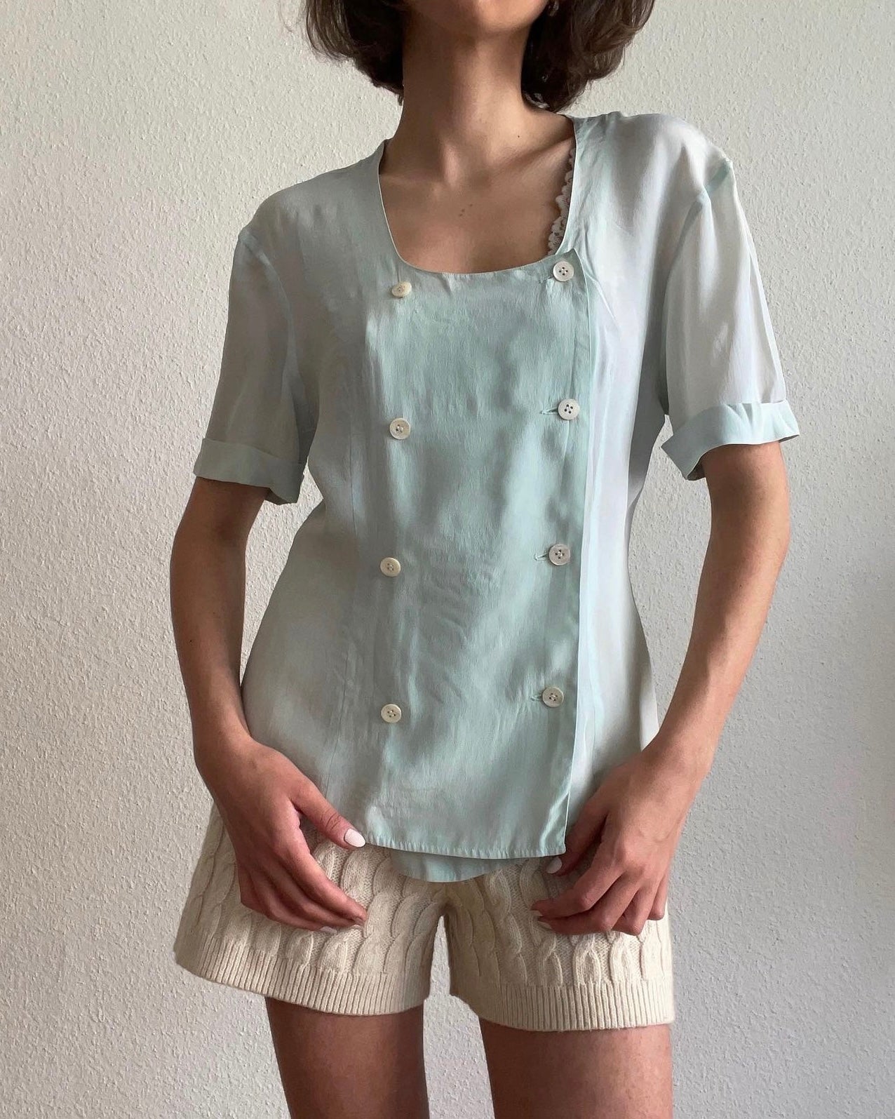 Light blue blouse with double buttonholes, very fine fabric